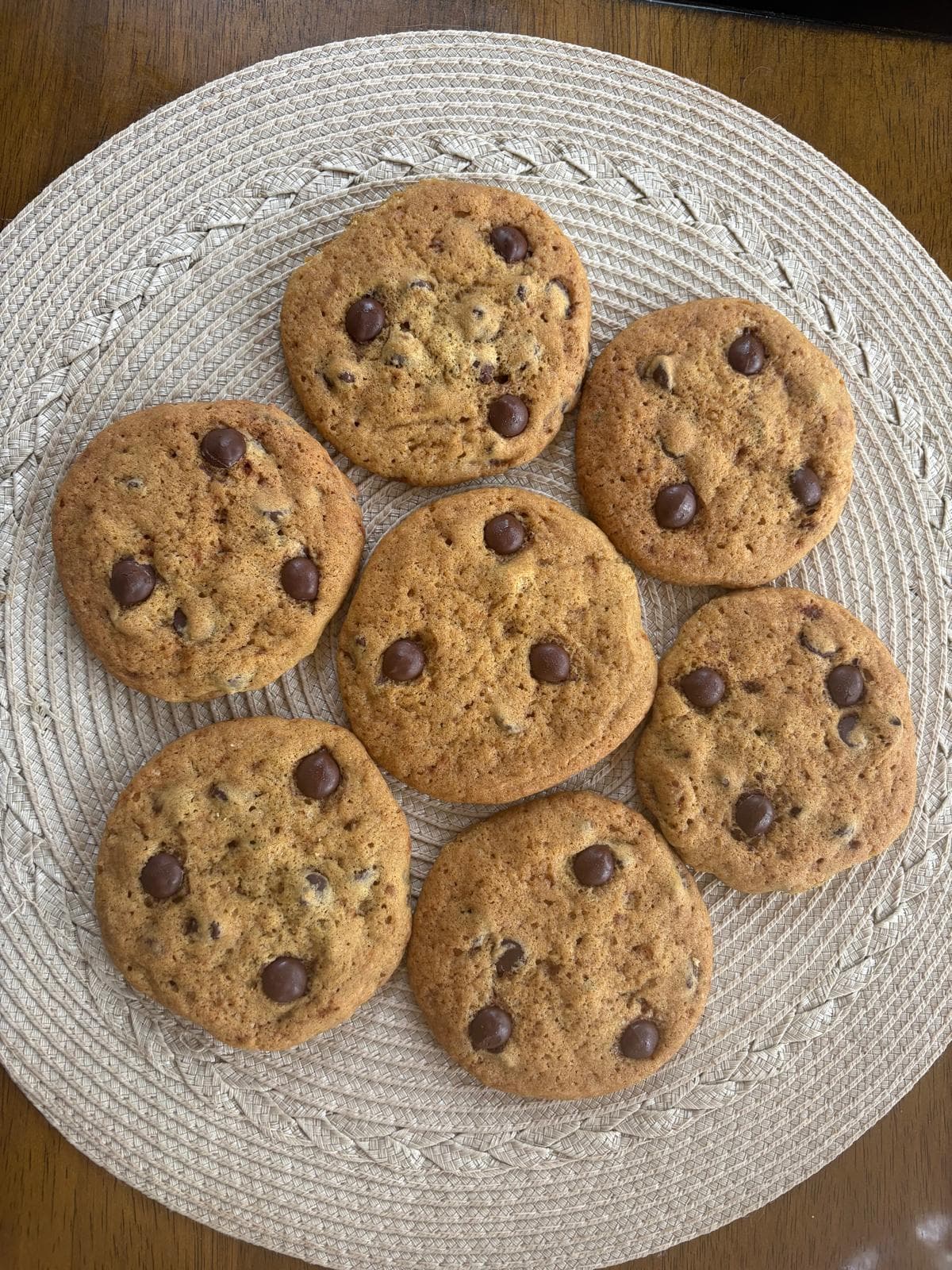 Chocolate chip cookies arranged on a woven placemat