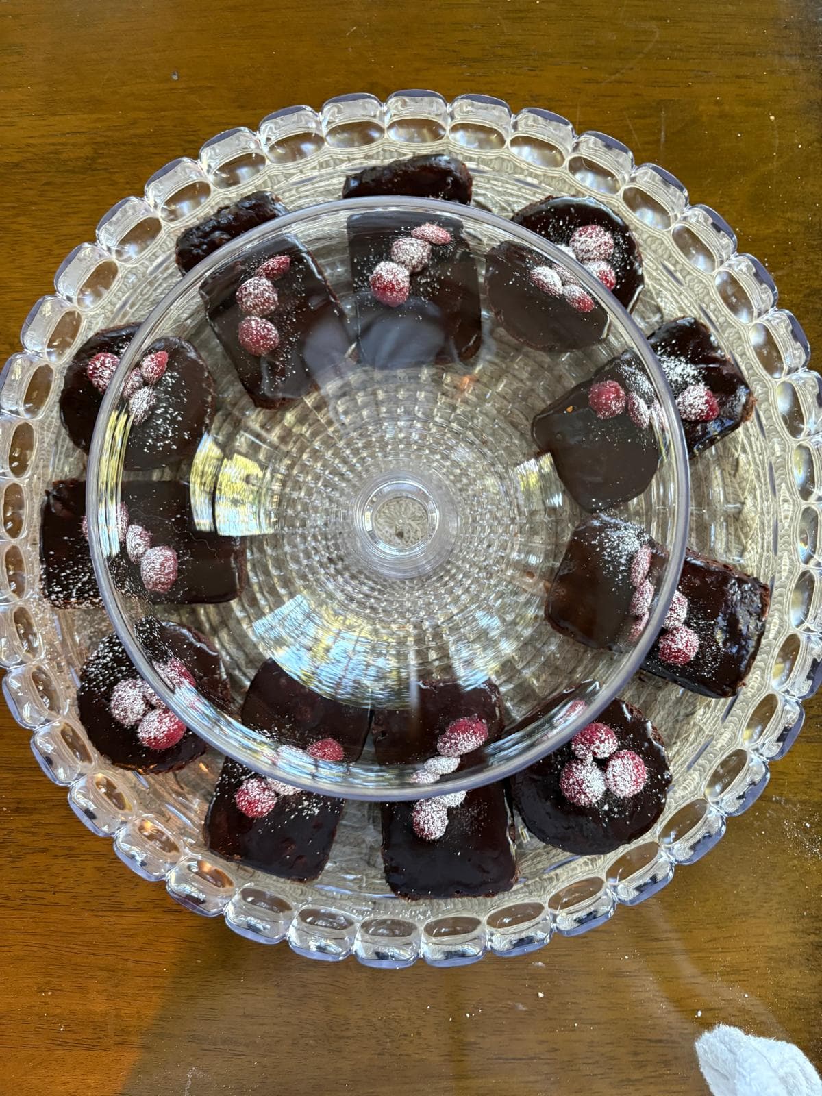 Chocolate raspberry pastries on a glass stand
